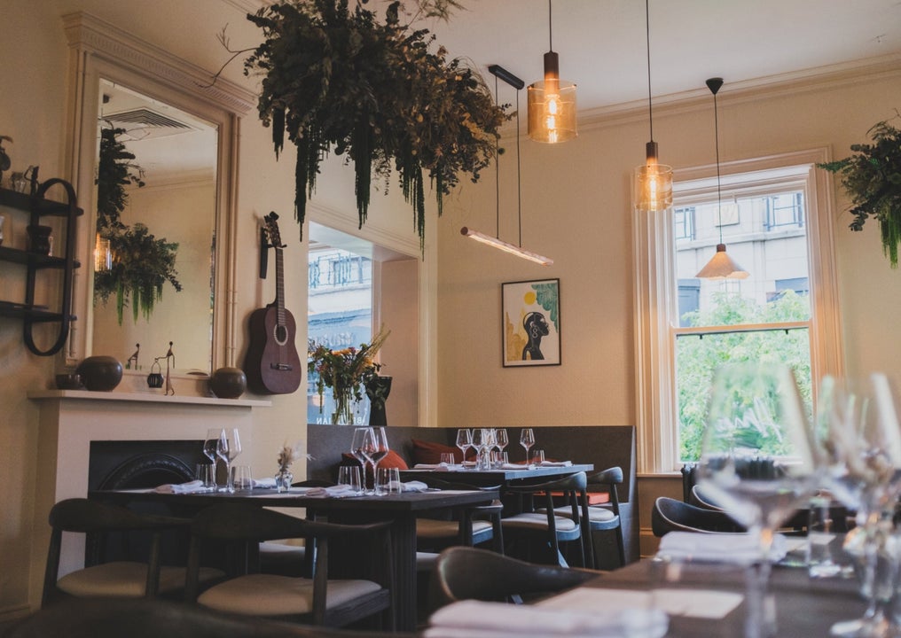 Seating and tables set for dining at Amai By Viktor