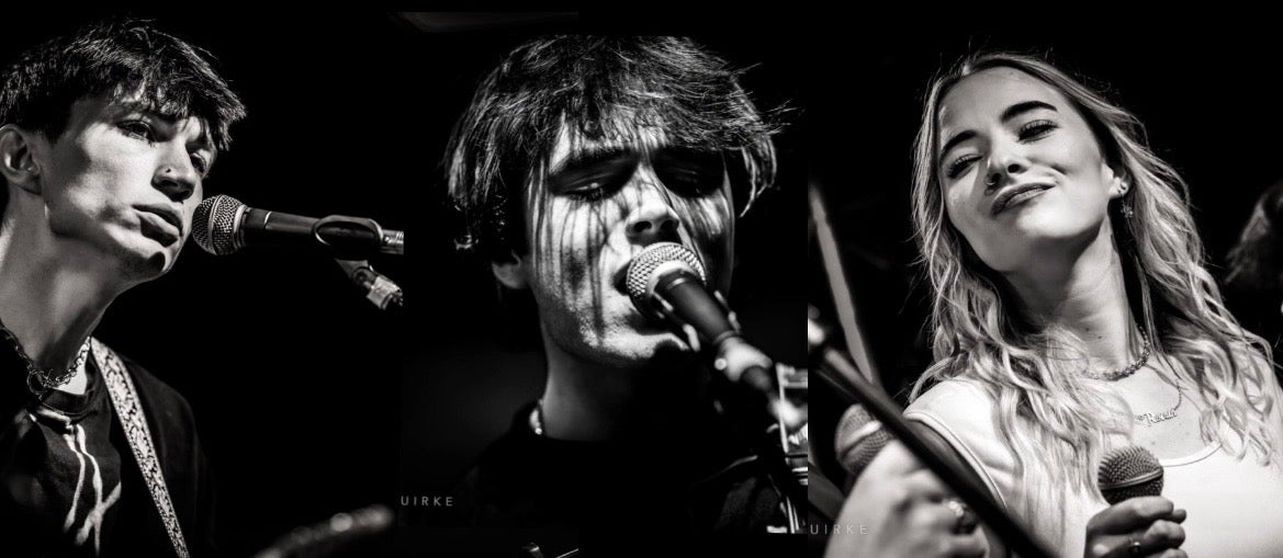 Singers with microphones.