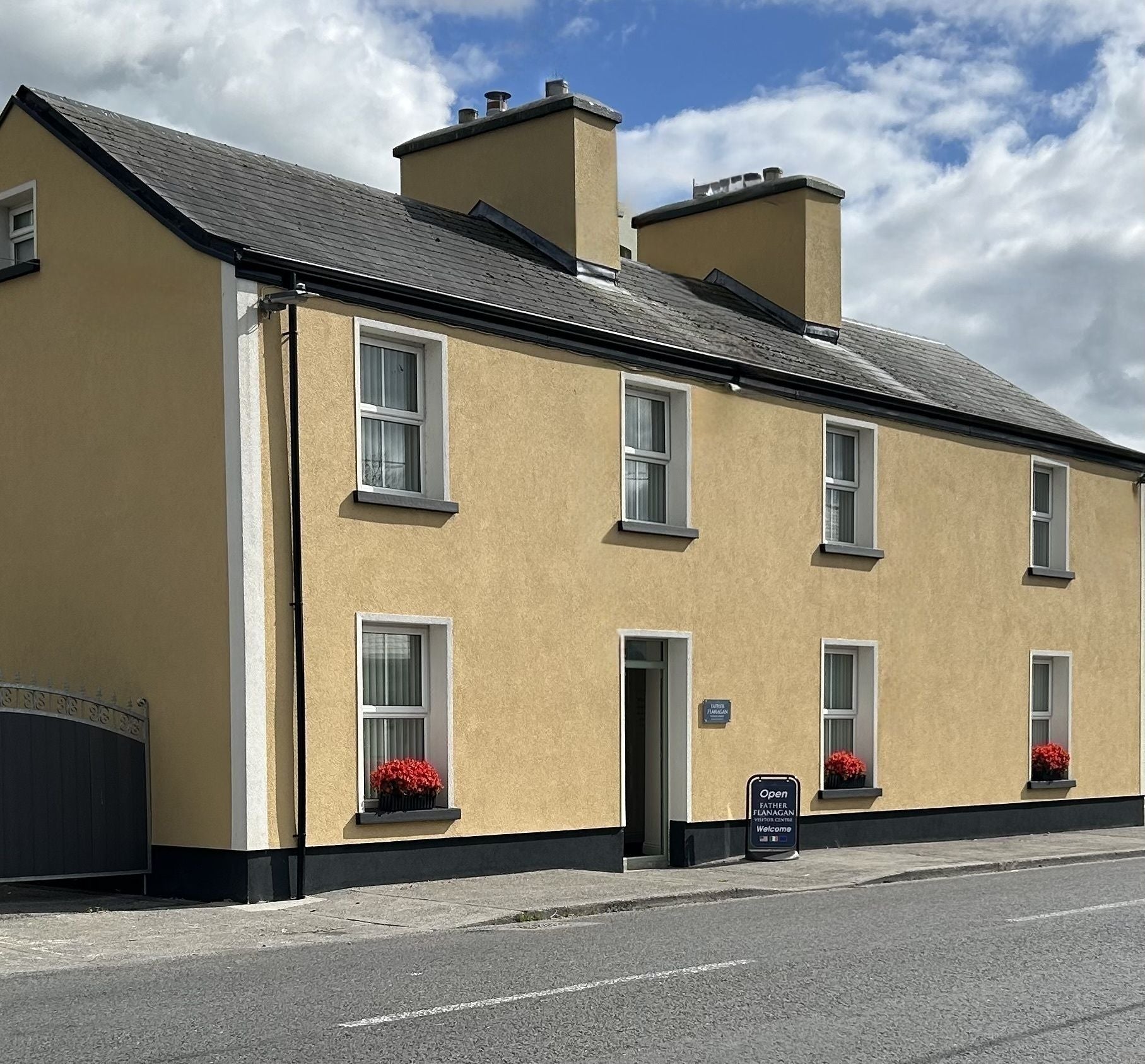 Exterior image of Father Flanagan Visitor Centre with a sign outside