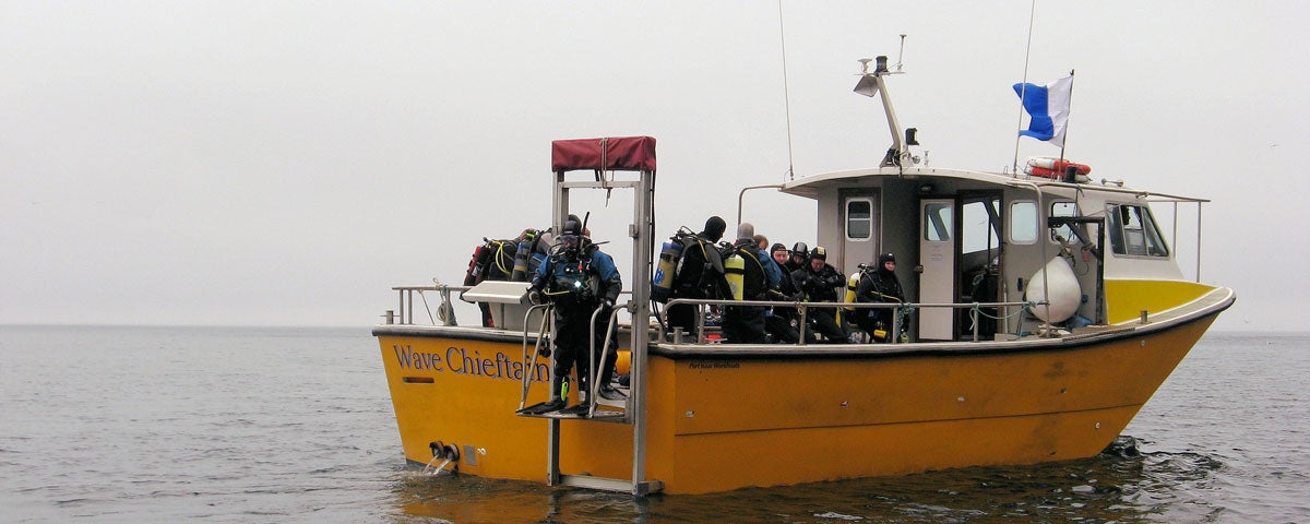 A dive group out at sea on the Wave Chieftain Aquaventures boat