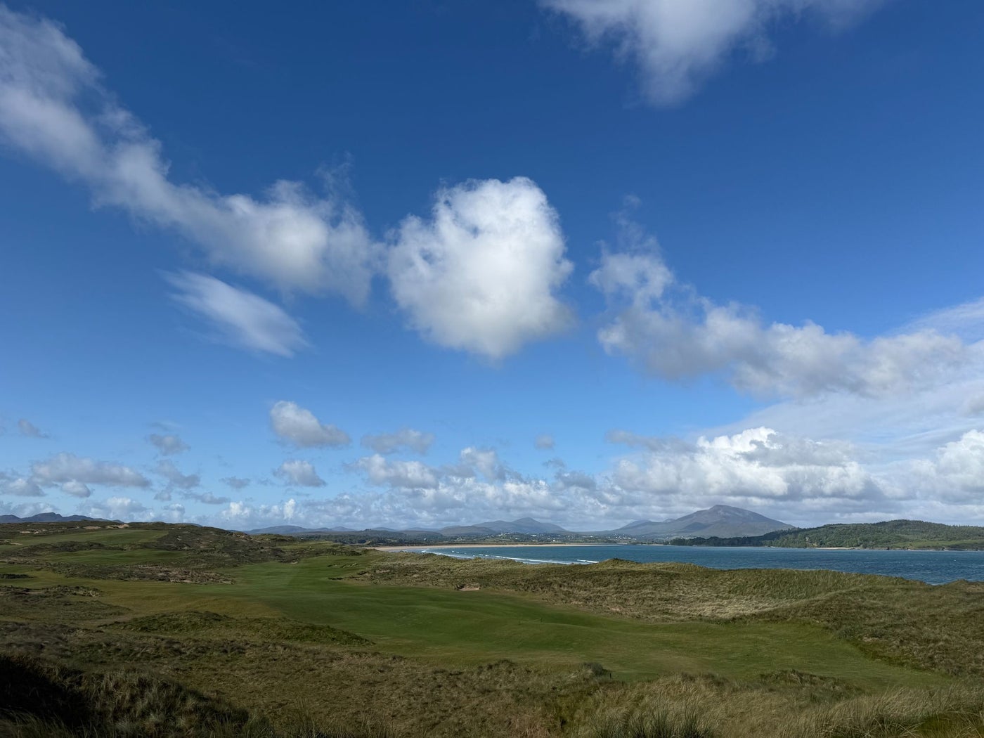 View from a rugged golf course onto the coast