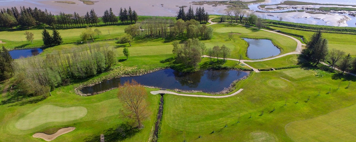 Letterkenny Golf Club aerial view of a green showing water features and Lough Swilly in the background