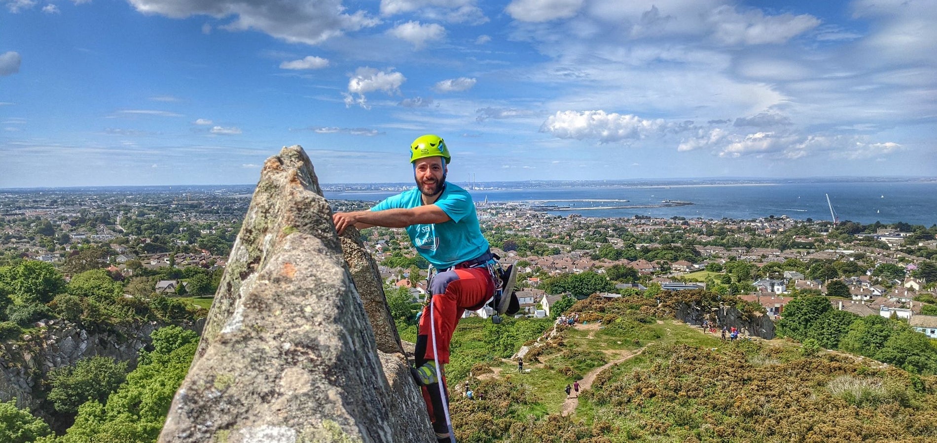 A person rock climbing outside Dublin with HikeandClimb