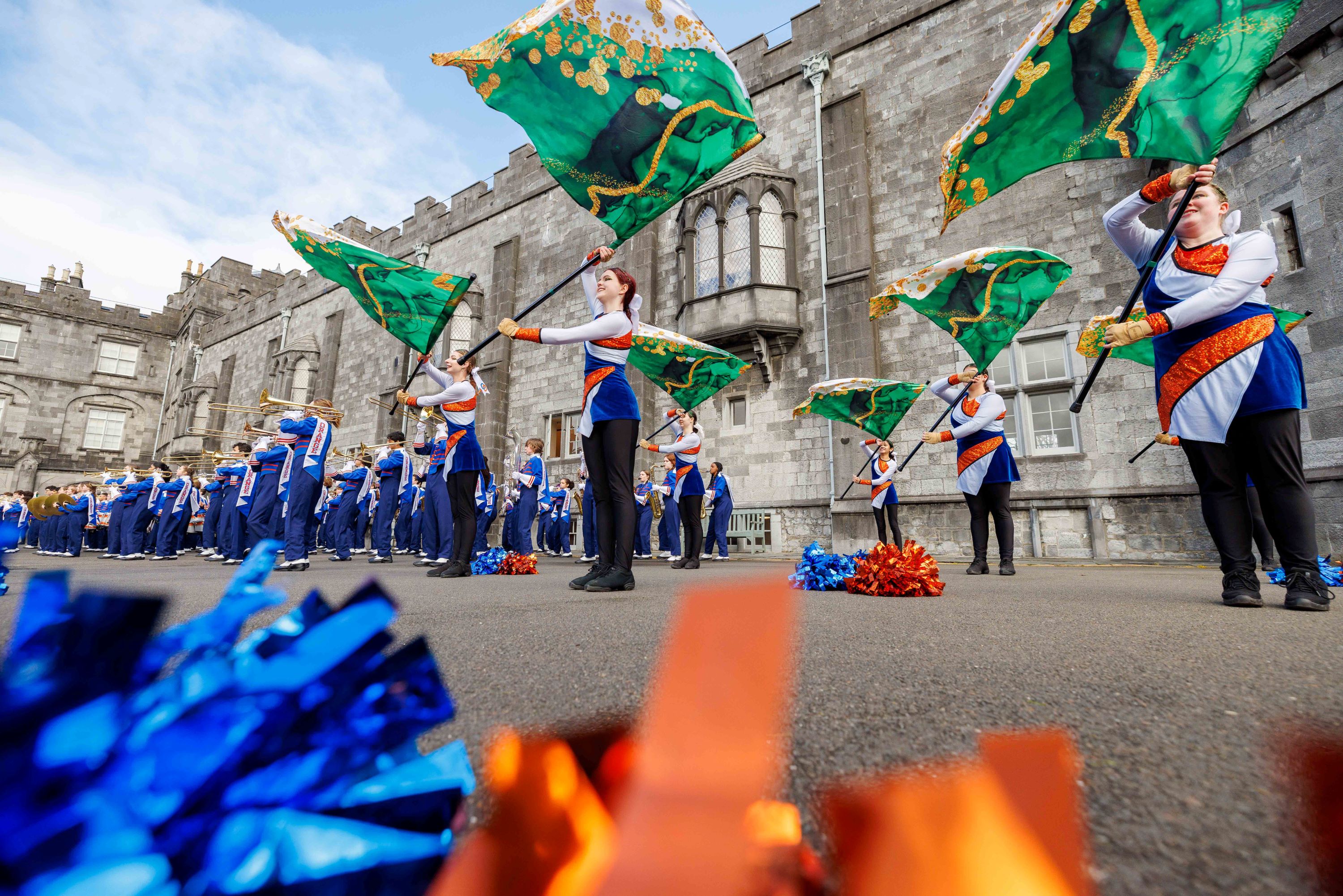 American Marching Band throw flags as part of a performance outside Kilkenny Castle.
