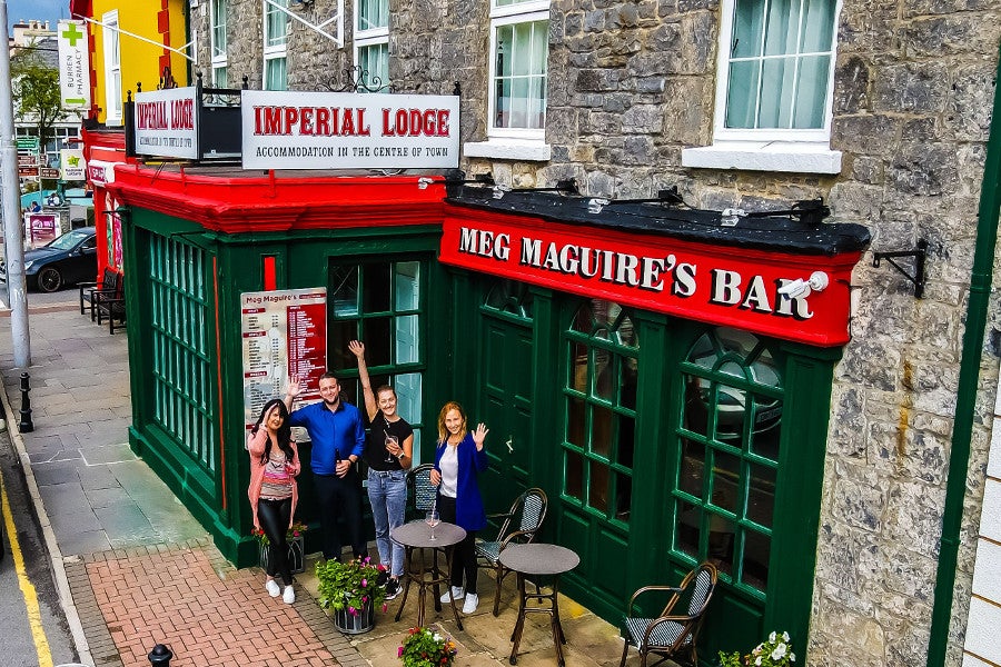 Front view of property with people outside