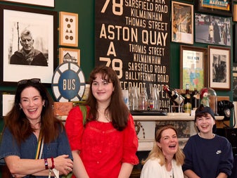 Visitors engaging with exhibits in a memorabilia filled gallery