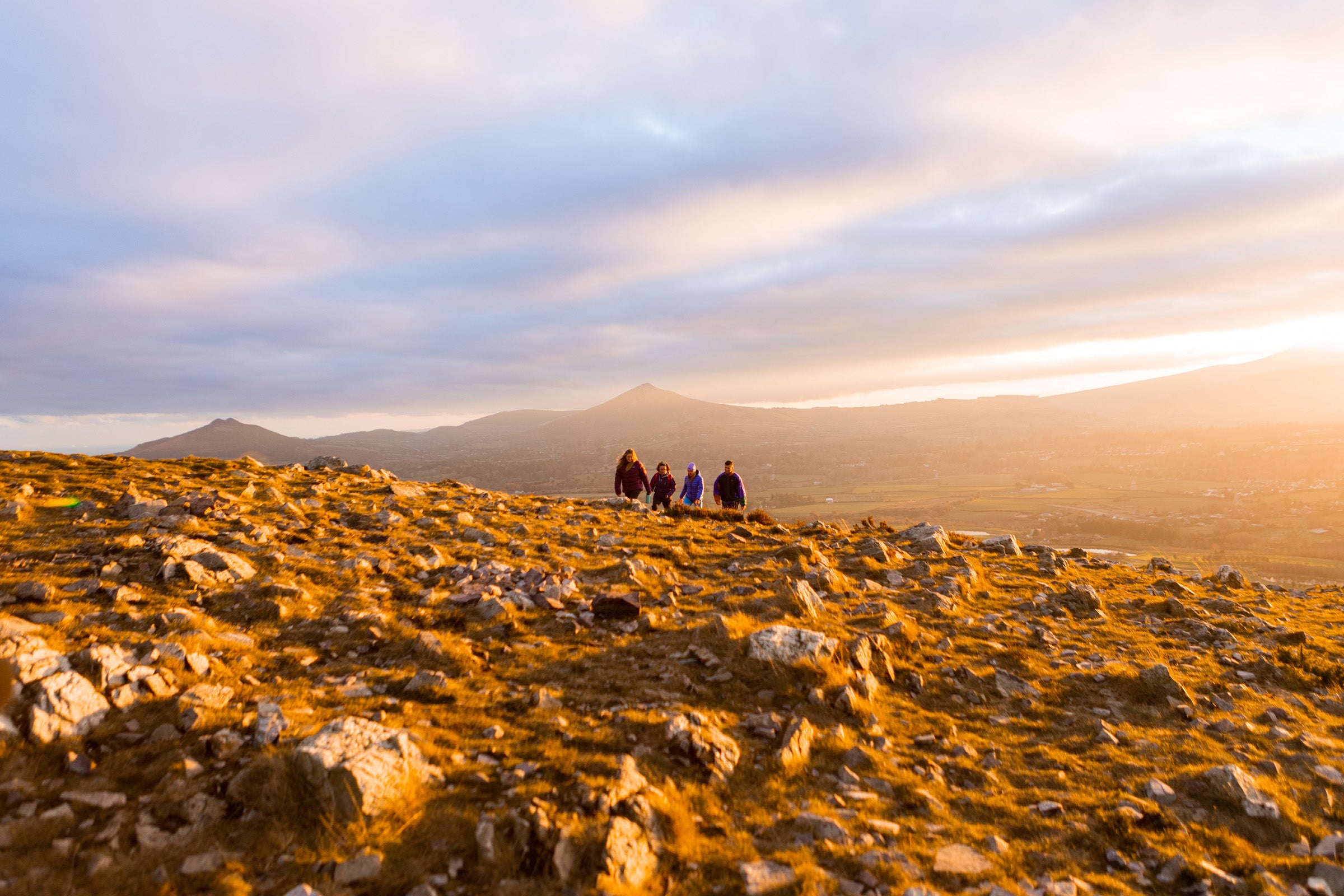Walkers at sunset, Hilltoptreks, Dublin