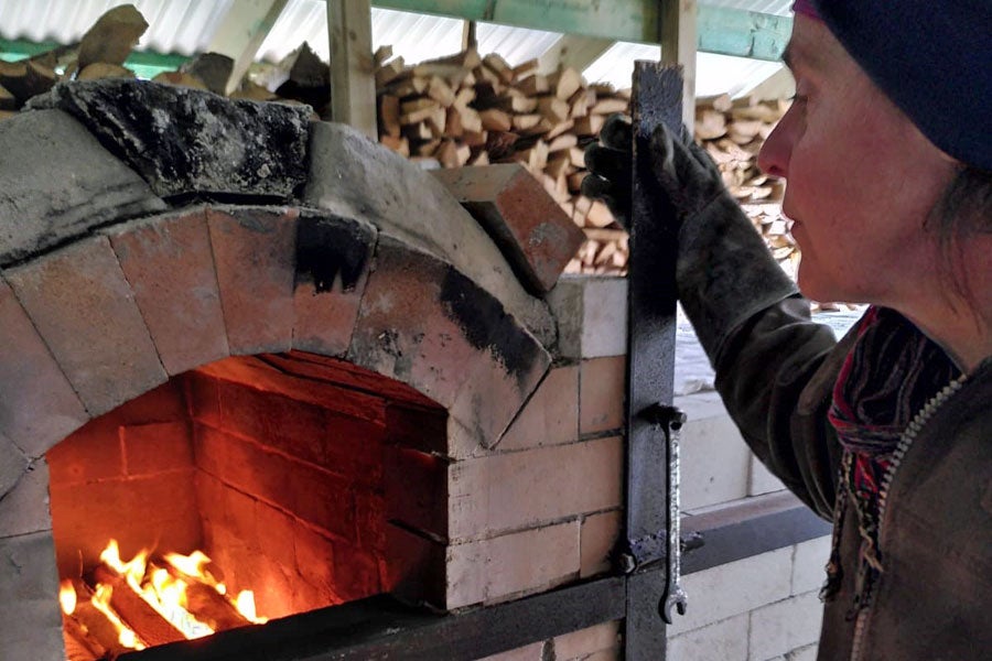 Ursula standing at the kiln