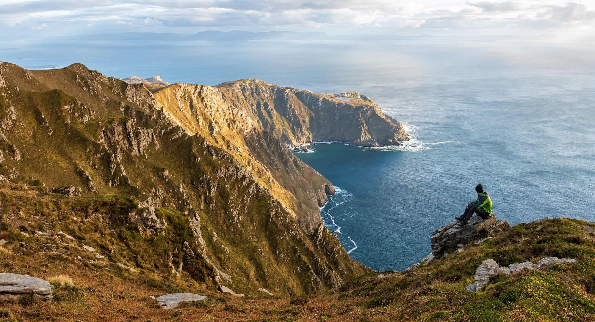 A hiker at Sliabh Liag (Slieve League) cliffs in Co Donegal