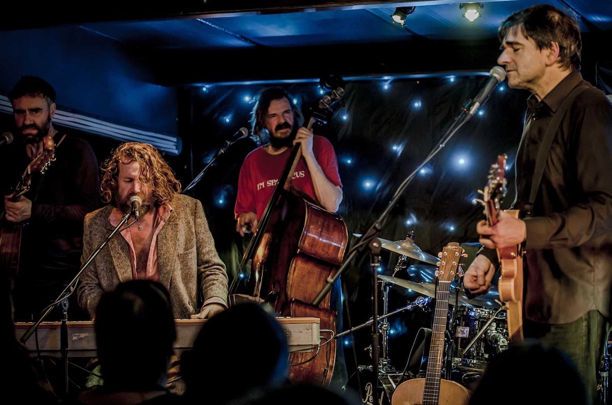 NCH Landmarks: Hothouse Flowers, a group of men playing instruments on a small stage.
