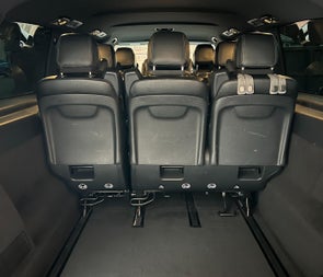 Looking into the back space of a bus with seats