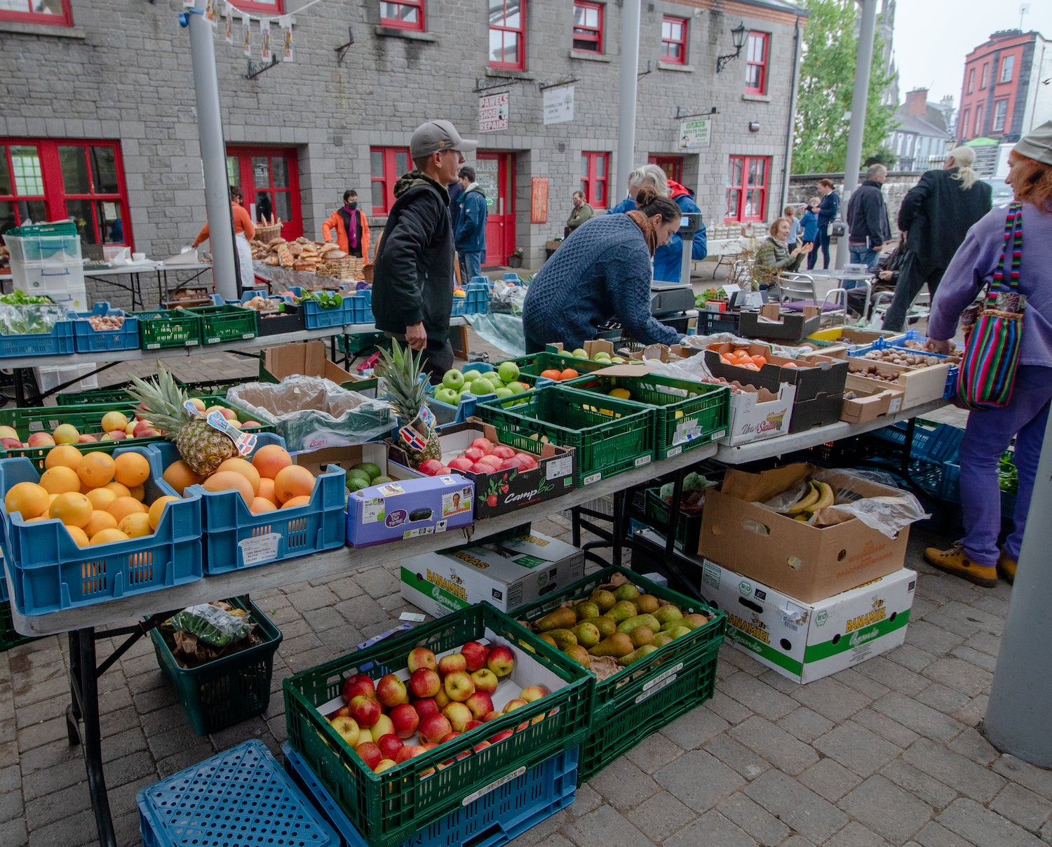 Merchants serving shoppers at the Carrick-on-Shannon Farmer's Market in County Leitrim.