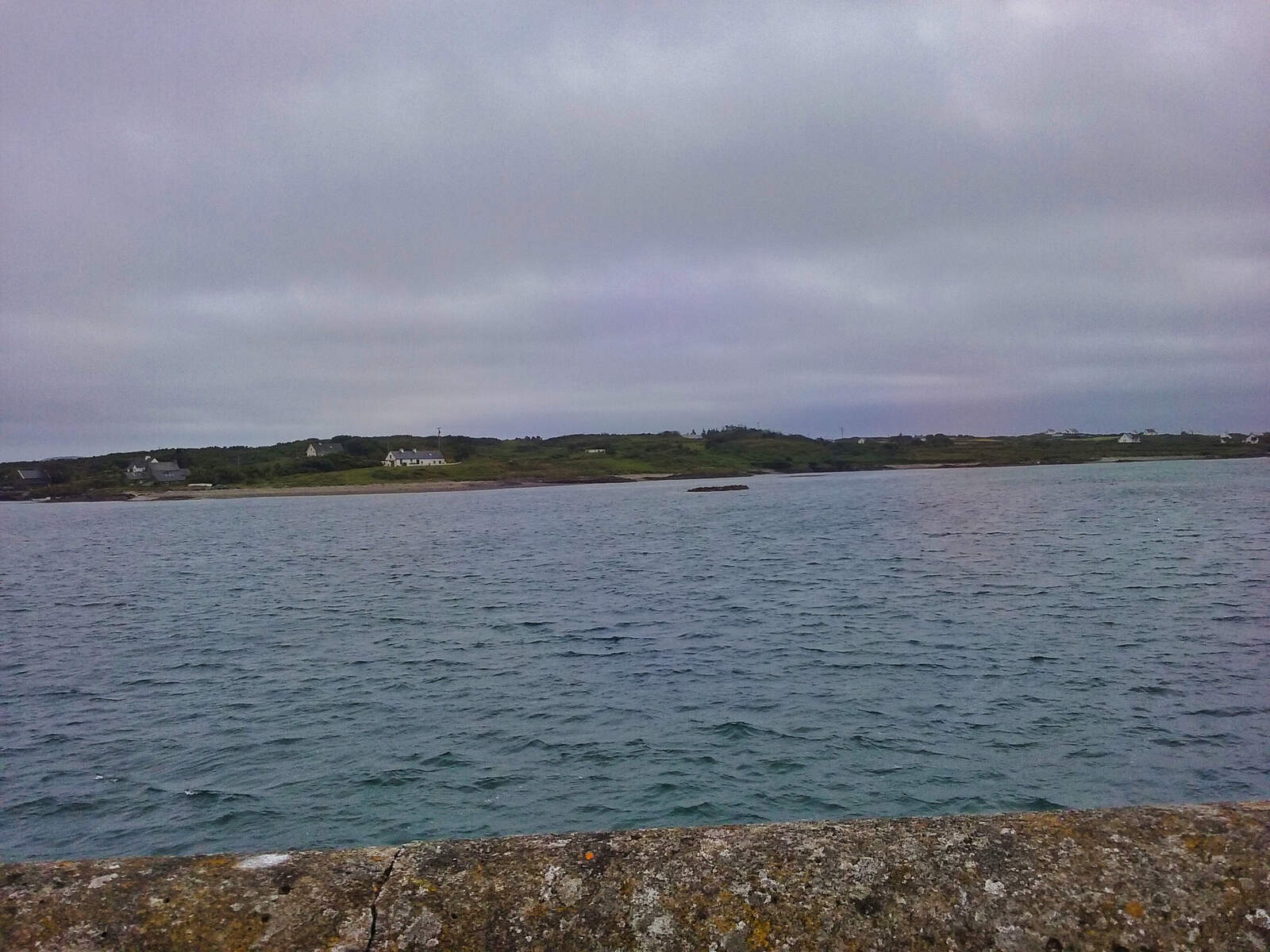 View from wall towards an island with a house in the distance