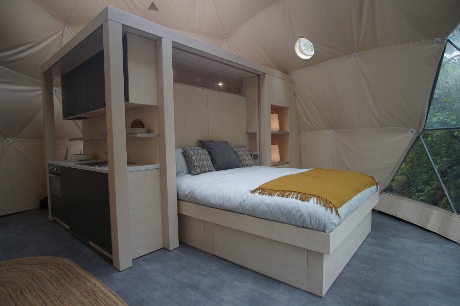 Double bed with white sheets