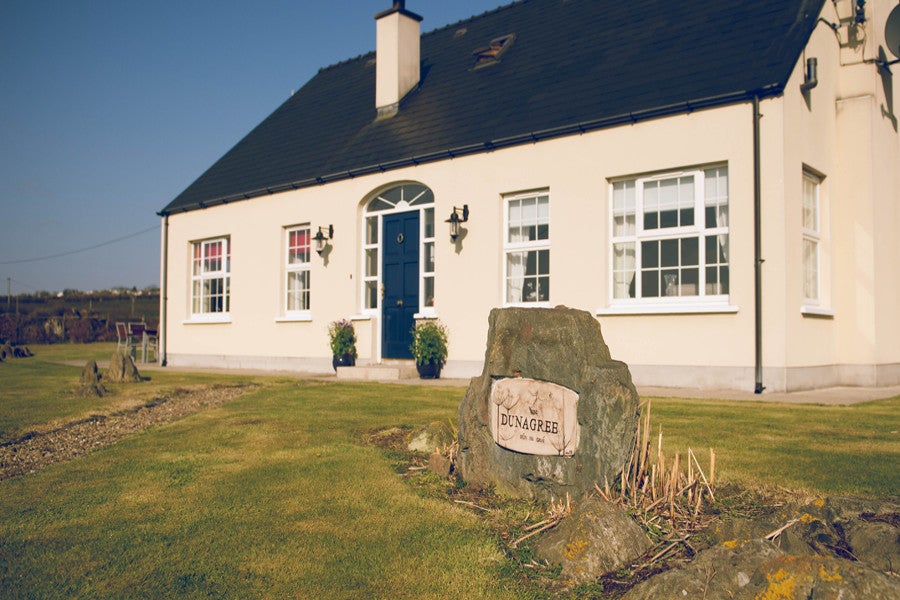 Cream house with blue door