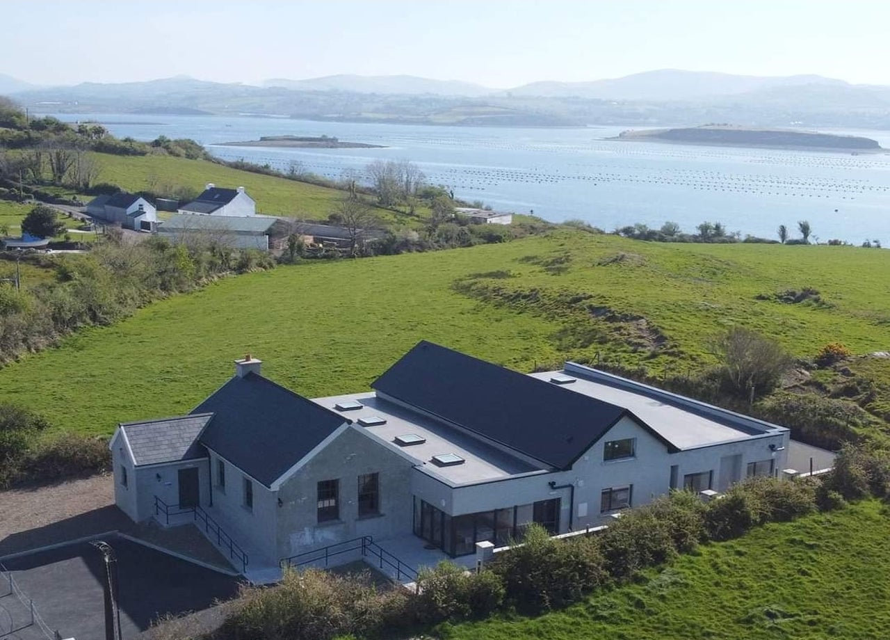 View of property and sea in the background