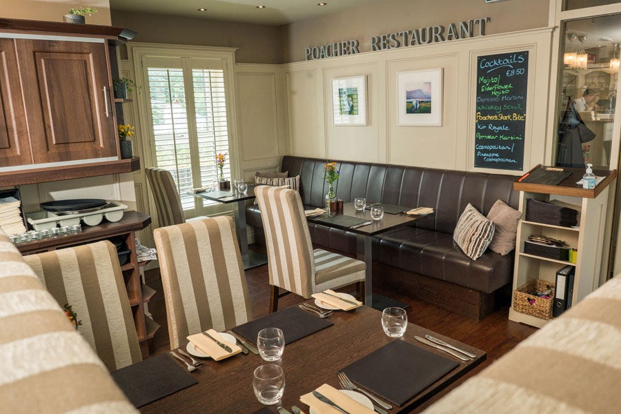 A view of the interior of Poacher Restaurant seating area