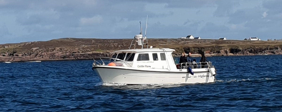 White fishing boat at Saoire Mara Charters Kincasslagh County Donegal