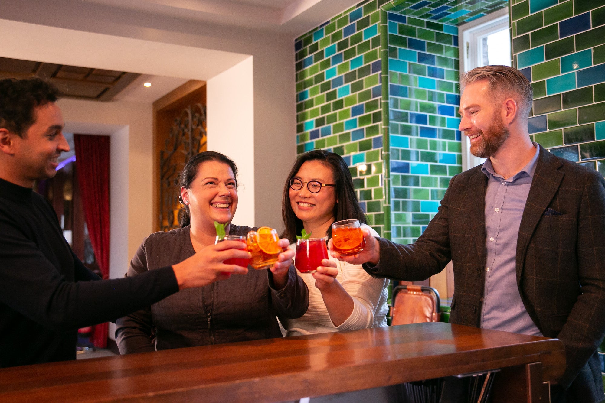Four people enjoying a drink at the Midleton Distillery Experience, County Cork.