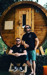 Two men outside an Irish Sweat House outdoor sauna