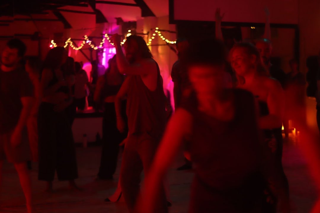 People dancing at an ecstatic dance in Dublin