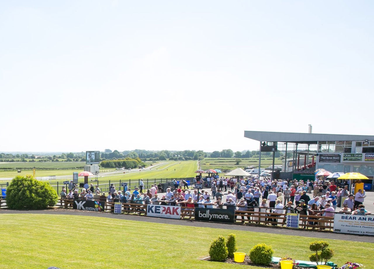 Race crowd by the grand stand