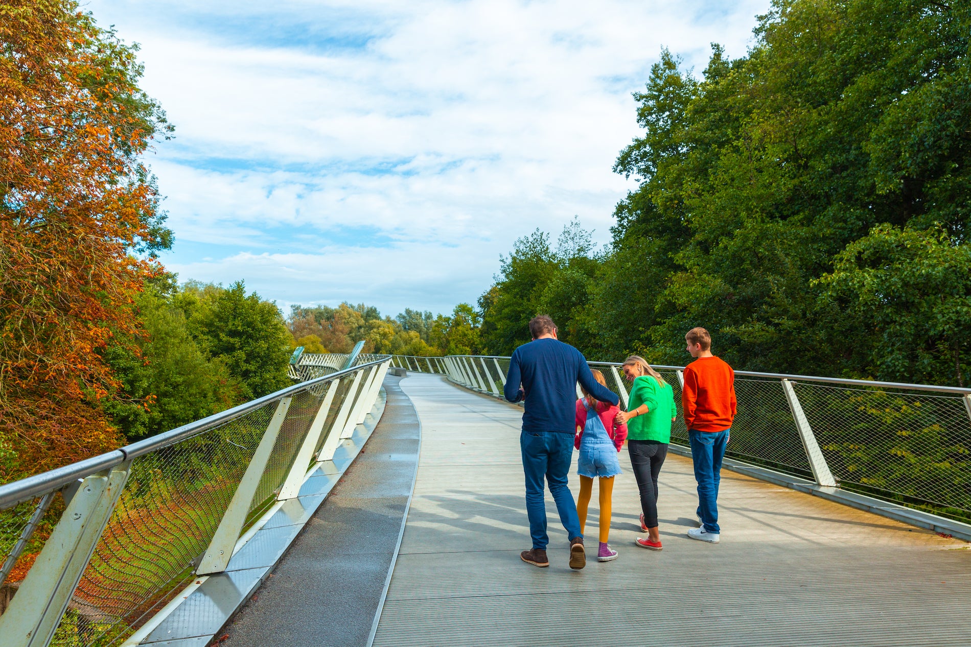 A family walking along The Living Bridge in Limerick.