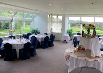 Function room with tables and flowers