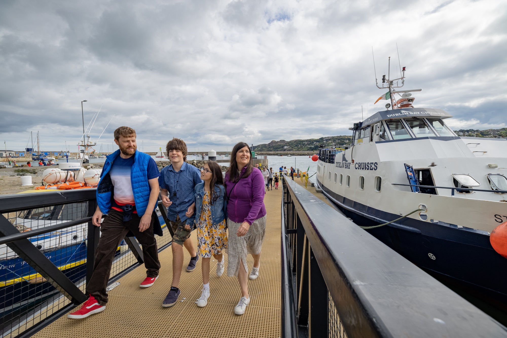 A family disembarking from a Dublin Bay Cruise boat.