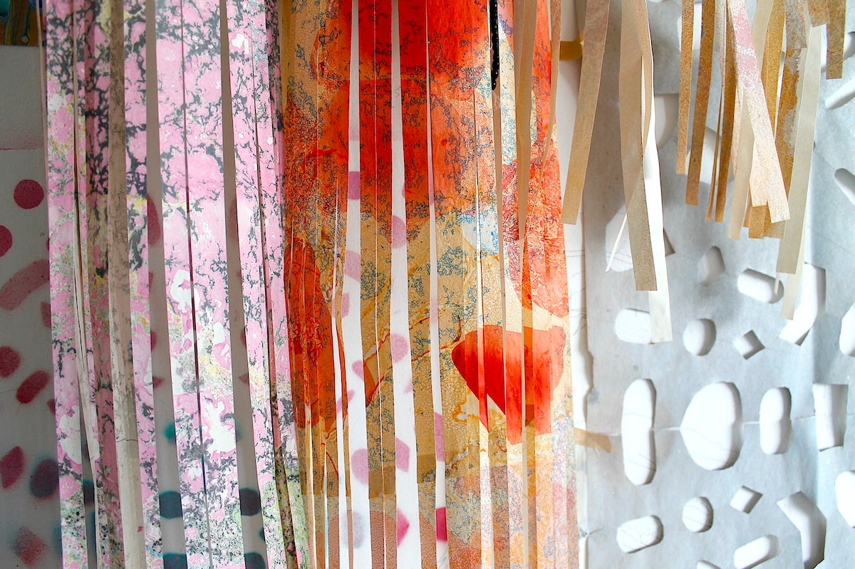 A photo of cuttings of colourful marbled paper