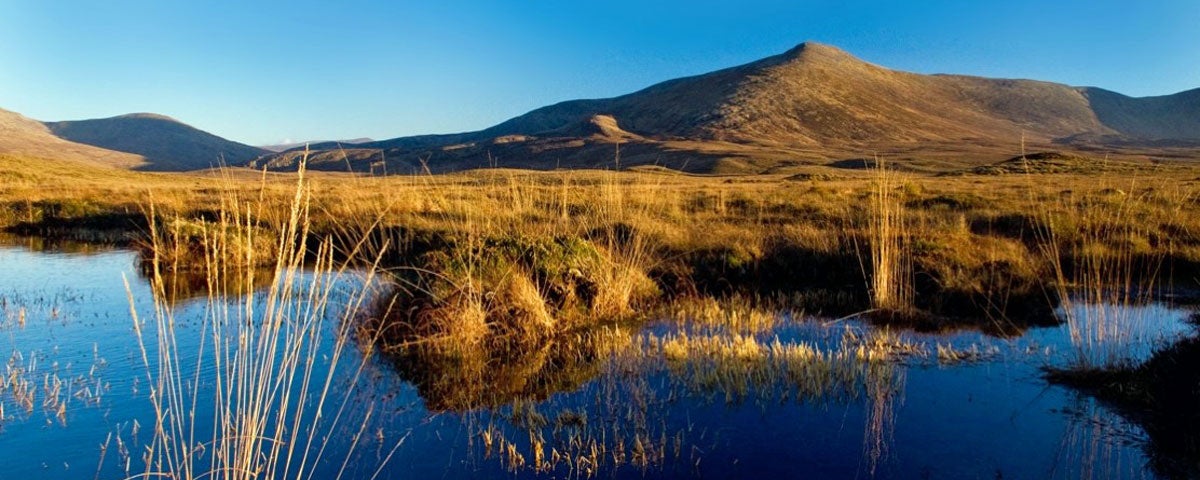 A reflection on the lake of the mountains within Ballycroy National Park