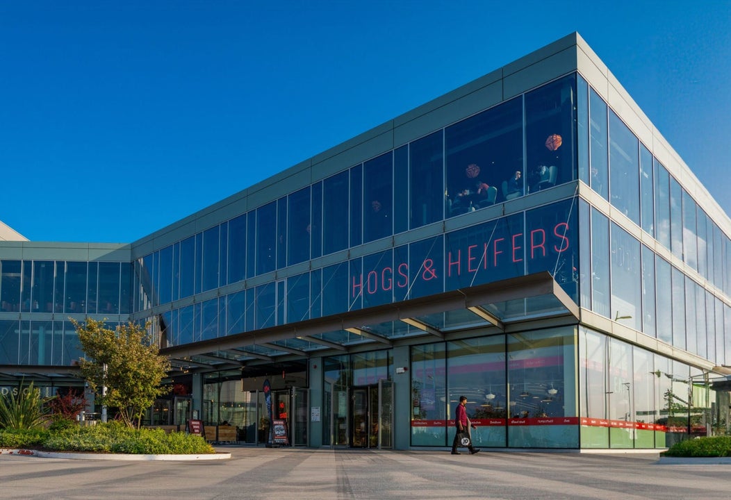 Glass front exterior of Hogs & Heifers restaurant 