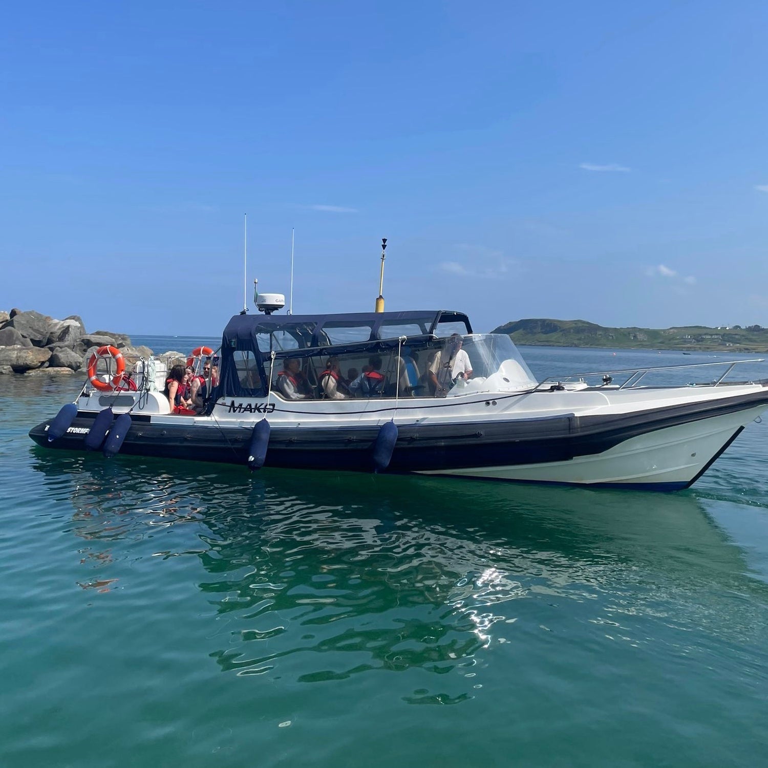 A True North Boating vessel prepares to depart on a coastal adventure from Culdaff