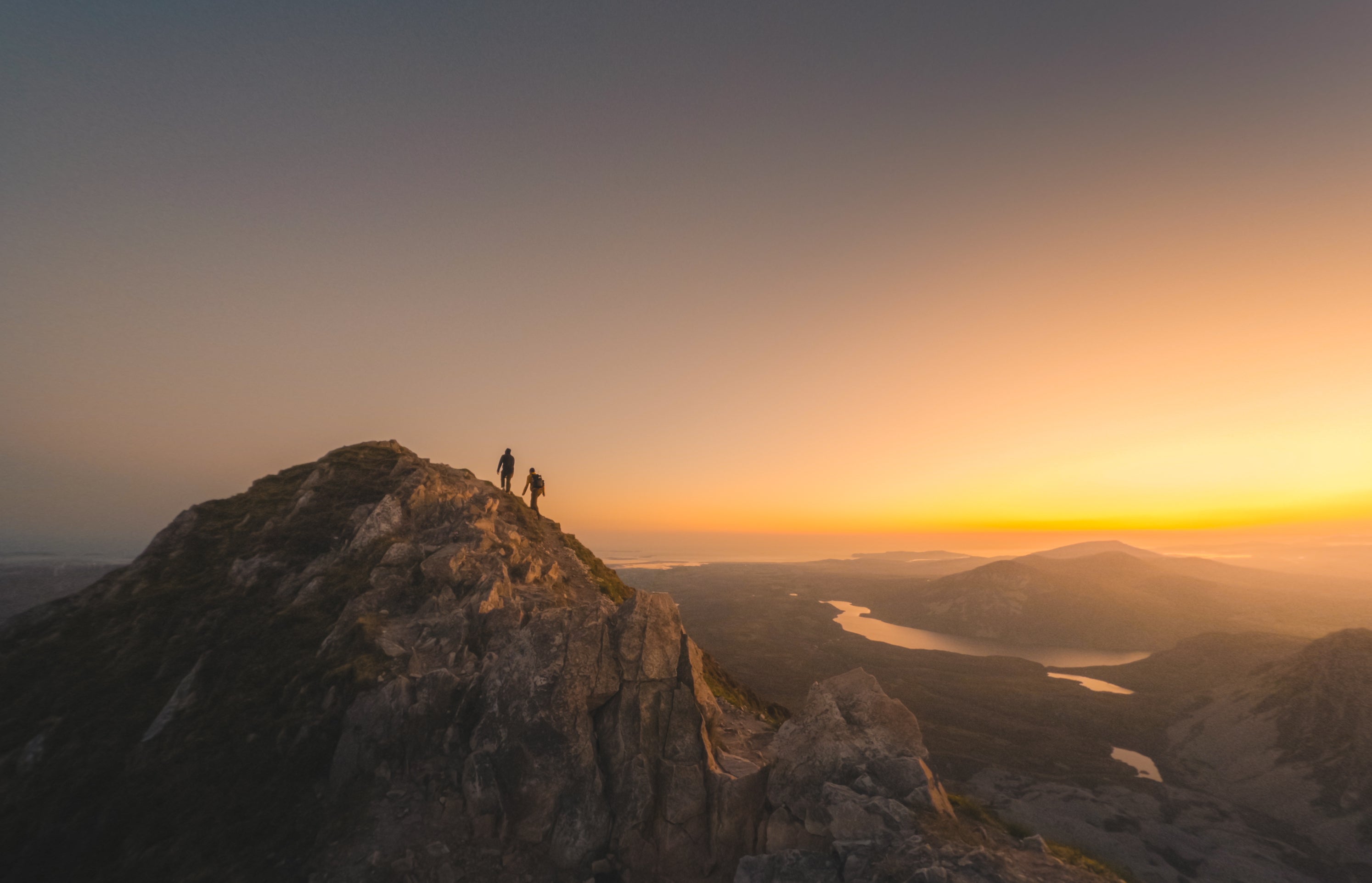 Hikers on Mount Errigal in Donegal at sunrise