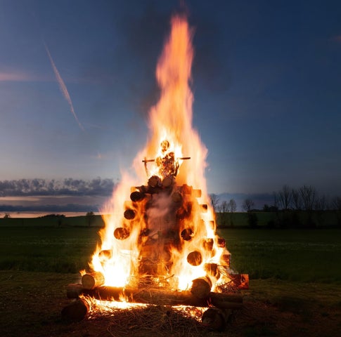 A bonfire burning at dusk