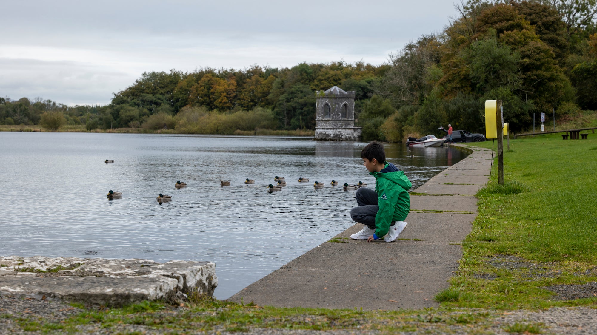 A child by a lake in Lough Key Forest Park in Co Roscommon