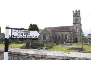 Signpost pointing towards a church and graveyard