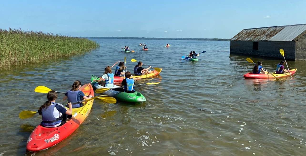 A group of girls canoeing at Lilliput Adventure Centre