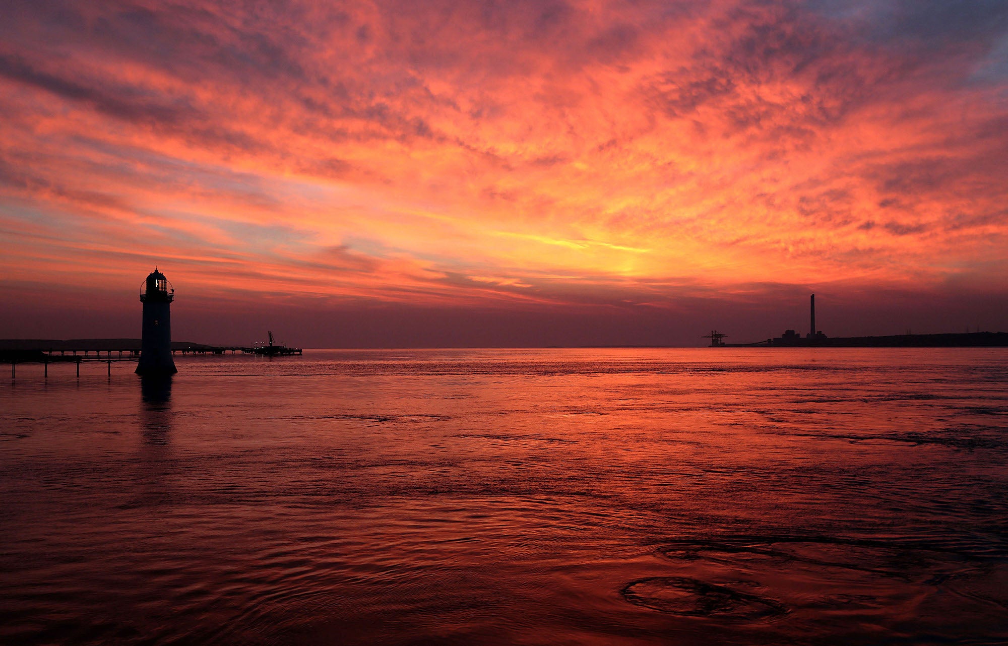 Tarbert Lighthouse in Tarbert, County Kerry at sunset.