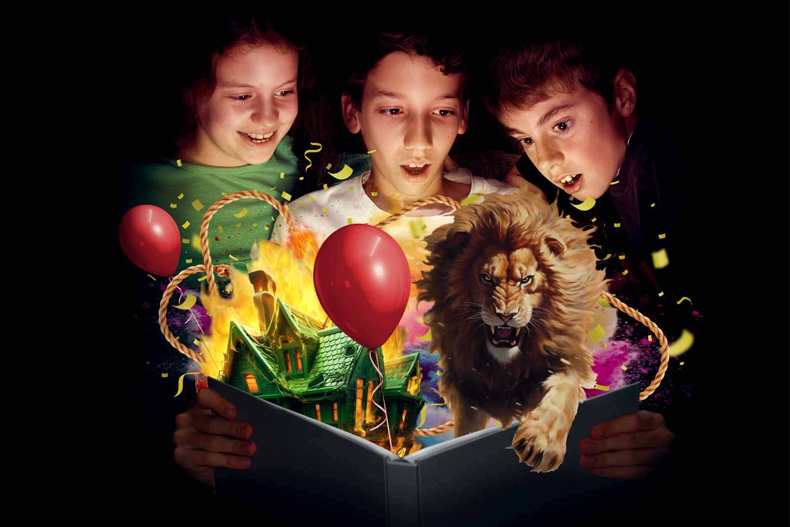 3 children looking with wonder at a large open book bursting open with a scary lion, balloons, a green house and flames, against black background.