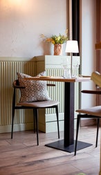 A table and two chairs in a restaurant