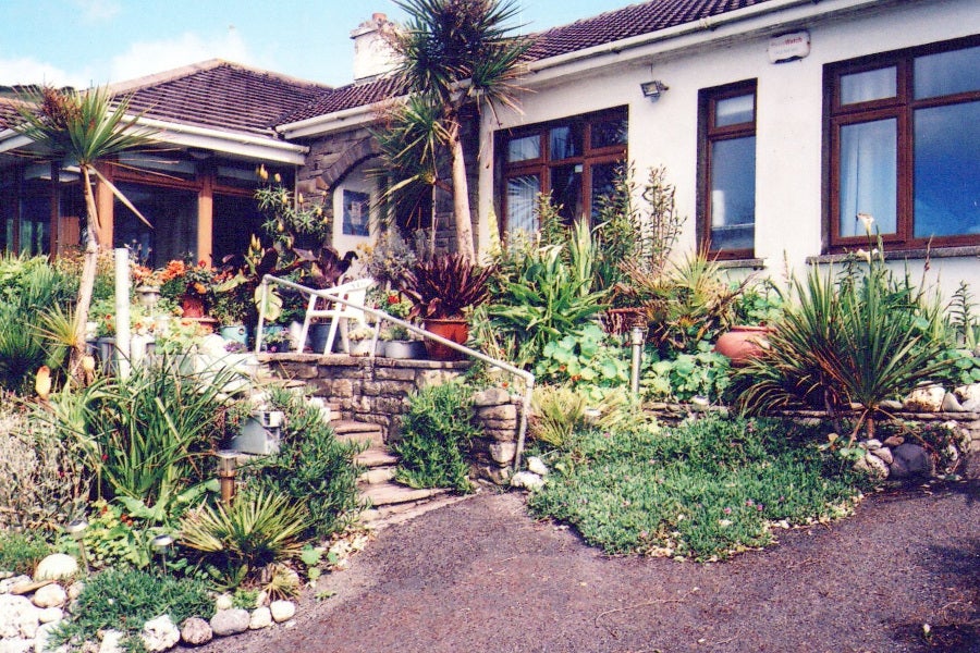 Front view of the house and garden.