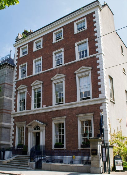 A tall Georgian building with red brick
