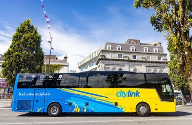 Side view of a blue and yellow bus with citylink written on its side
