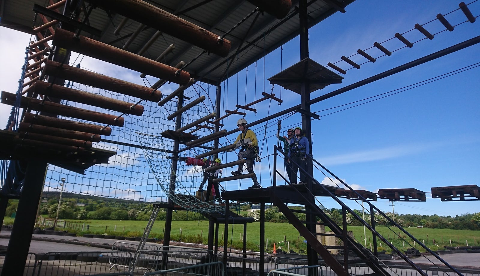 Children with helmets on high ropes at an activity centre