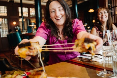 Two ladies having a toasted sandwich