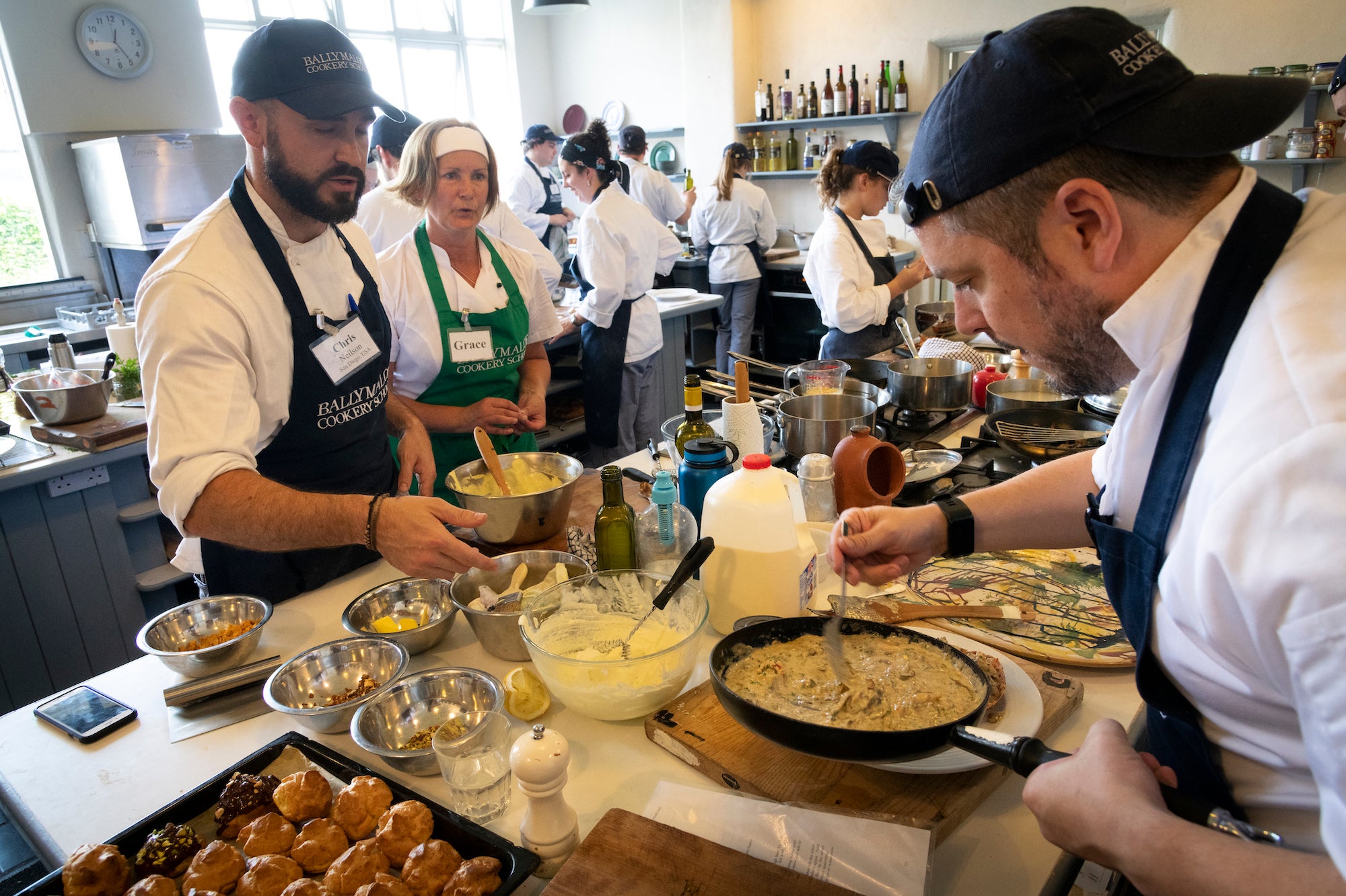 People taking a cooking class at the Ballymaloe Cookery School.