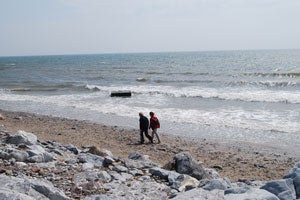 Couple walking on Garryvoe Beach