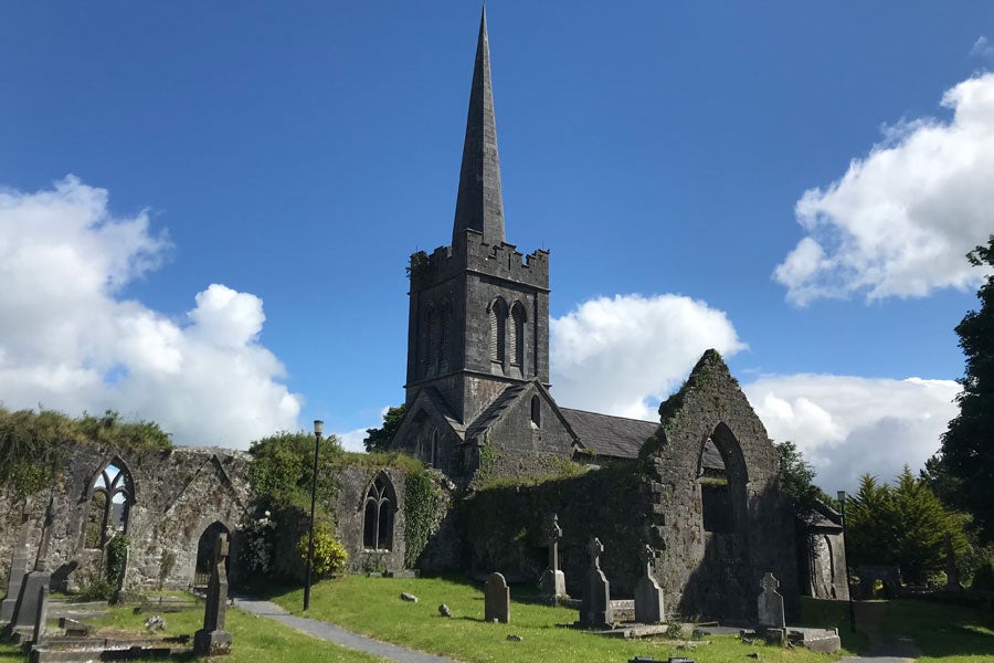 Exterior view of Athenry Arts and Heritage Centre with graveyard in front
