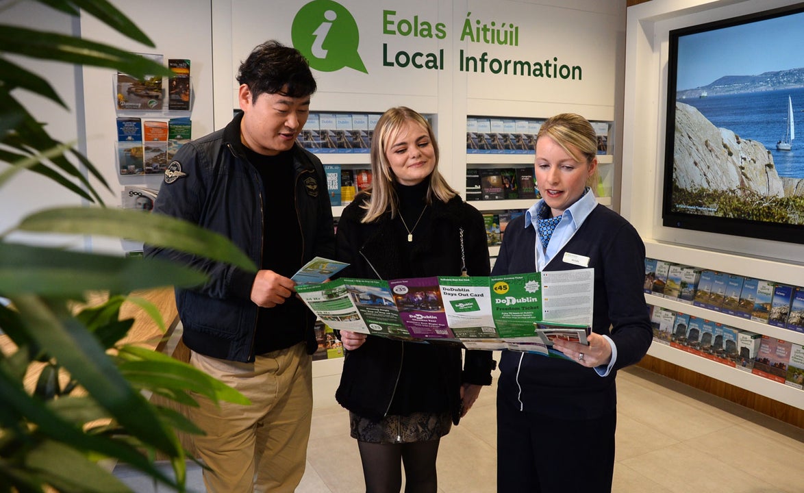A member of staff at Dublin Tourist Information Centre Barnardo Square assisting visitors